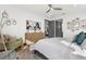 Bright bedroom with a ceiling fan, a patterned rug and a comfortable chair, creating a relaxing space at 511 45Th N Ave, St Petersburg, FL 33703