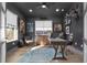 Modern office with dark walls, contemporary furnishings, bright windows, and stylish décor for a productive workspace at 511 45Th N Ave, St Petersburg, FL 33703