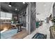 Elegant office space featuring dark walls, modern decor, and an open doorway leading into a brightly lit living area at 511 45Th N Ave, St Petersburg, FL 33703