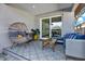 Relaxing covered patio showcasing modern outdoor furniture, patterned tiles, and a peaceful ambiance at 511 45Th N Ave, St Petersburg, FL 33703