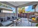 Inviting covered patio featuring stylish furniture, decorative tile flooring, and privacy fencing at 511 45Th N Ave, St Petersburg, FL 33703