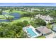 Aerial view showcasing the community's golf course, clubhouse, pool, and well-maintained landscaping at 5115 Tobermory Way, Bradenton, FL 34211
