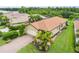 Beautiful home with a brick driveway, landscaping, and a tile roof in a neighborhood at 5115 Tobermory Way, Bradenton, FL 34211