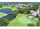Scenic aerial view of the golf course and water features within the surrounding residential community at 5115 Tobermory Way, Bradenton, FL 34211