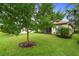 Lush backyard with healthy green grass, showcasing the home's outdoor living space and landscaping at 5115 Tobermory Way, Bradenton, FL 34211