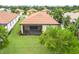A beautiful backyard with lush green grass and manicured landscaping around the house at 5115 Tobermory Way, Bradenton, FL 34211