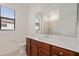 Bathroom featuring a sink, toilet and window at 5115 Tobermory Way, Bradenton, FL 34211