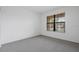 Bright bedroom featuring neutral carpet and a window with horizontal blinds at 5115 Tobermory Way, Bradenton, FL 34211