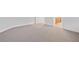 Bedroom featuring neutral carpet and an open doorway to the bathroom at 5115 Tobermory Way, Bradenton, FL 34211