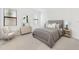 A beautifully styled bedroom featuring neutral tones, contemporary furniture, and ample natural light at 5115 Tobermory Way, Bradenton, FL 34211