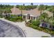 Beautiful clubhouse exterior with inviting entrance, elegant landscaping, and a paved driveway at 5115 Tobermory Way, Bradenton, FL 34211