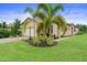 Charming home exterior showcasing manicured landscaping and a paver driveway for added curb appeal at 5115 Tobermory Way, Bradenton, FL 34211