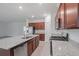 Well-equipped kitchen with a granite island, stainless steel appliances and ample cabinet space at 5115 Tobermory Way, Bradenton, FL 34211