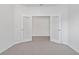 Office space with double frosted glass doors and neutral carpet at 5115 Tobermory Way, Bradenton, FL 34211