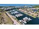 Extensive aerial view showcases a marina, waterways, with many boats, homes and waterfront properties at 525 Bahia Beach Blvd, Ruskin, FL 33570