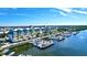 Breathtaking aerial view of luxury condo buildings, yachts, and a stunning waterfront at 525 Bahia Beach Blvd, Ruskin, FL 33570