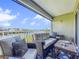 Relax on the comfortable, furnished balcony with a beautiful waterfront view and railing at 525 Bahia Beach Blvd, Ruskin, FL 33570