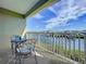 Relax on this covered balcony that provides an outdoor dining set and calming water views at 525 Bahia Beach Blvd, Ruskin, FL 33570