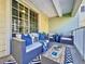 Comfortable balcony with wicker seating and striped rug at 525 Bahia Beach Blvd, Ruskin, FL 33570
