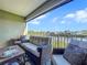 Cozy outdoor balcony with comfortable seating and picturesque waterfront views at 525 Bahia Beach Blvd, Ruskin, FL 33570