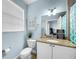 This bright bathroom has a granite countertop and ample storage space at 525 Bahia Beach Blvd, Ruskin, FL 33570