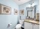 Powder bath with granite vanity and coastal decor at 525 Bahia Beach Blvd, Ruskin, FL 33570