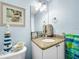 Powder bath with decorative seaside lighthouse and sink at 525 Bahia Beach Blvd, Ruskin, FL 33570