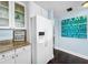 Modern kitchen featuring stainless steel appliances and adjacent light blue accent wall at 525 Bahia Beach Blvd, Ruskin, FL 33570