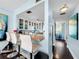 Open kitchen featuring a breakfast bar with seating and a view of the entryway at 525 Bahia Beach Blvd, Ruskin, FL 33570