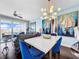 Bright open-concept living and dining area with modern furnishings and beautiful artwork at 525 Bahia Beach Blvd, Ruskin, FL 33570