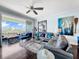 Stylish living room featuring modern furniture, dark hardwood floors, and a balcony view at 525 Bahia Beach Blvd, Ruskin, FL 33570