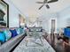 Comfortable living room with stylish furnishings, a ceiling fan, and dark, polished wood floors at 525 Bahia Beach Blvd, Ruskin, FL 33570