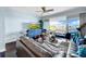 Bright living room with dark hardwood floors, modern furnishings, and access to a balcony at 525 Bahia Beach Blvd, Ruskin, FL 33570