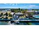 Picturesque waterfront property featuring a restaurant, marina, and pool surrounded by palm trees at 525 Bahia Beach Blvd, Ruskin, FL 33570