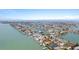 Aerial view of the neighborhood showcasing the property's location on the waterfront with canal access at 571 Johns Pass Ave, Madeira Beach, FL 33708