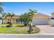 Inviting single-Gathering home boasting a well-maintained lawn, a convenient two-car garage, and charming curb appeal at 571 Johns Pass Ave, Madeira Beach, FL 33708