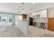 Bright kitchen featuring an island with granite countertop and access to water view at 571 Johns Pass Ave, Madeira Beach, FL 33708