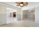 Spacious living room with ceiling fan, and open layout, ready for renovation at 571 Johns Pass Ave, Madeira Beach, FL 33708