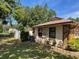 Secluded backyard with a white fence and tasteful landscaping at 5905 Caroline Dr, Wesley Chapel, FL 33545