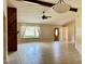 Open-concept living room with ceramic tile flooring and large window at 5905 Caroline Dr, Wesley Chapel, FL 33545