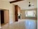 Bright living room with large window, fireplace and neutral tile flooring at 5905 Caroline Dr, Wesley Chapel, FL 33545