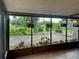 Screened patio featuring view of backyard at 5905 Caroline Dr, Wesley Chapel, FL 33545