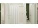 Clean bathroom showcasing a walk-in shower with white tiling and a simple, functional layout at 7730 Painted Sky Pl, Land O Lakes, FL 34637