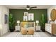 Charming Bedroom with crib, neutral tones, and plant decor at 7730 Painted Sky Pl, Land O Lakes, FL 34637