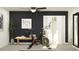 Contemporary exercise room with bike, plant, and dark accent wall at 7730 Painted Sky Pl, Land O Lakes, FL 34637