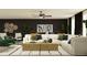 Stylish living room featuring dark accent walls, decorative wall art, and a plush white sectional sofa at 7730 Painted Sky Pl, Land O Lakes, FL 34637