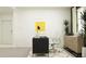 This office offers a computer and desk, lots of natural light, and stylish décor at 7730 Painted Sky Pl, Land O Lakes, FL 34637