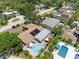 Aerial view of backyard pool and solar panels at 8300 37Th N Ave, St Petersburg, FL 33710