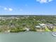 Expansive aerial view featuring waterfront property, mature trees, and beautiful scenery, ideal for upscale living at 8300 37Th N Ave, St Petersburg, FL 33710