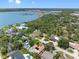 Aerial view showcases a home with a pool and landscaping, near the water at 8300 37Th N Ave, St Petersburg, FL 33710